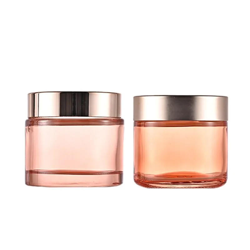 Orangefarbenes rundes kosmetisches Cremeglas