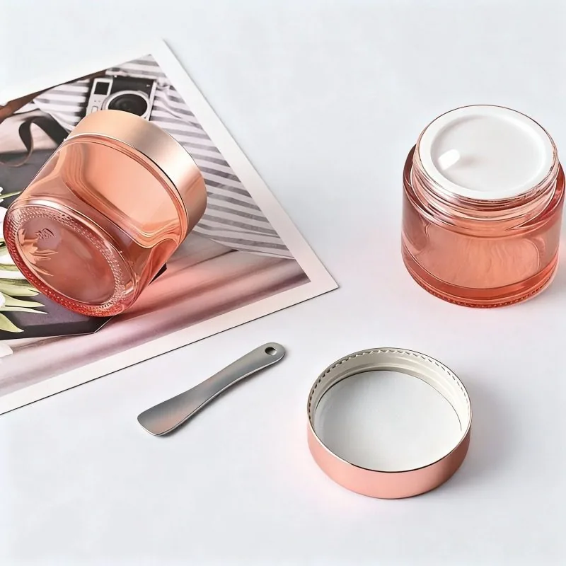 Orangefarbenes rundes kosmetisches Cremeglas