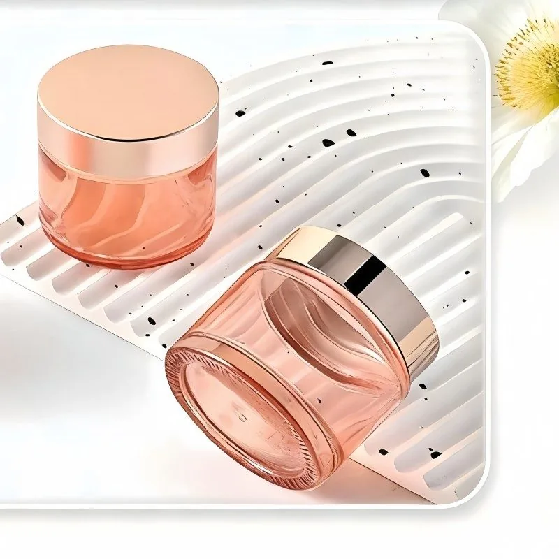 Orangefarbenes rundes kosmetisches Cremeglas